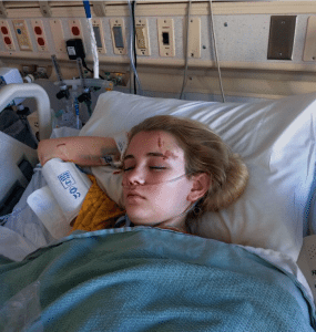 A photo of London Lyle sleeping in a hospital bed.