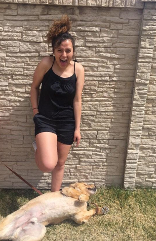 Jasmine Porr, shown with a dog, before she suffered a severe brain injury