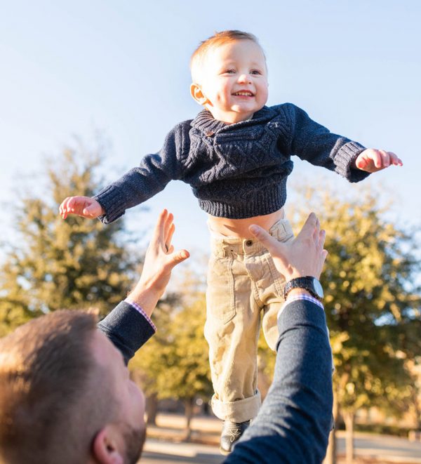 Tilman's dad throws him in the air. His mom gave birth to him after going through IVF.