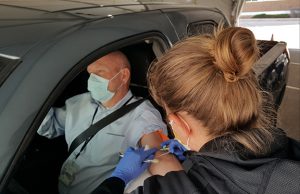 man get's blood drawn at drive-thru testing site, which is now also open at highlands ranch hospital.