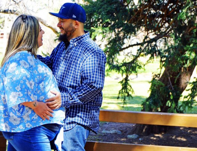 Pregnant Jade and Mike in a park. Jade would give birth while covid-positive at 35 weeks pregnant.